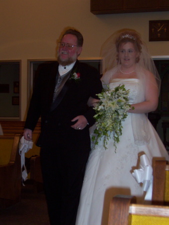 My dad walking me down the aisle.