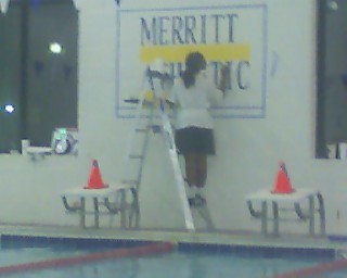 Janol painting a sign at Merritt