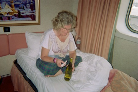 Lynn opening a bottle of wine
