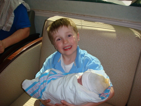 Grandson with new baby cousin