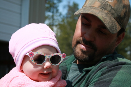 Trying out her new shades w/ dad.