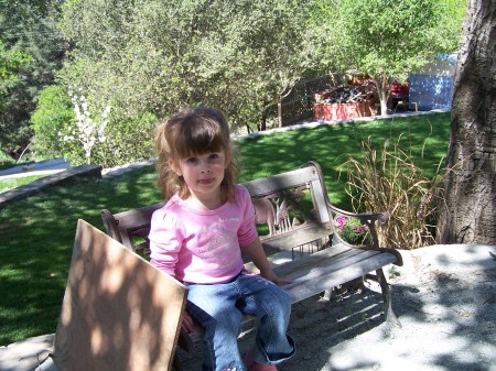 Sarah on her bench in the kids play area