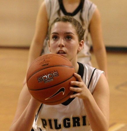 Jenn playing high school varsity basketball