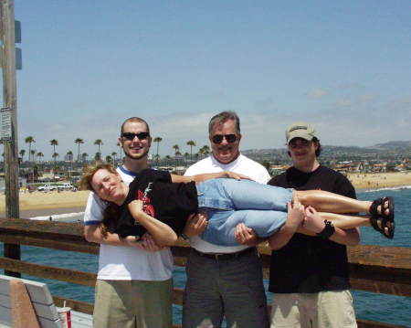 The family "fishing" off the Newport Bch Pier