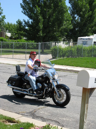Katie and Grandpa riding the motorcycle