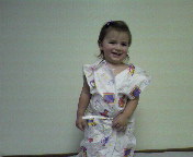 Modeling a paper gown at the doc's office.