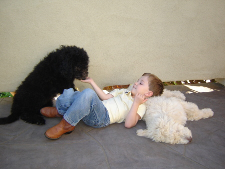 My son Conner and our 2 new pups 5/09