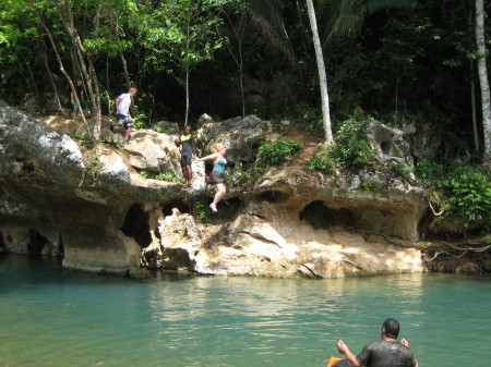 Me jumping off a cliff in Belize.
