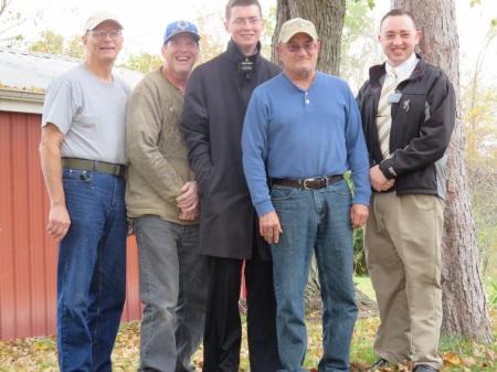 Ron Bailiff in light blue shirt with wood cutting Crew