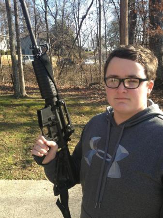 my son Austin holding AR 15.