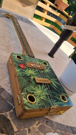 building cigar box guitar for the hell of it.