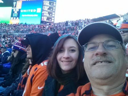 My daughter Kim with me at a Broncos game