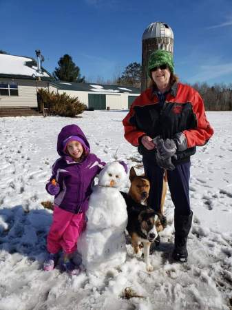 Building a snowman with granddaughter Kathryn