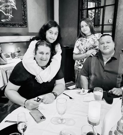 Mark, and I with our daughters at dinner