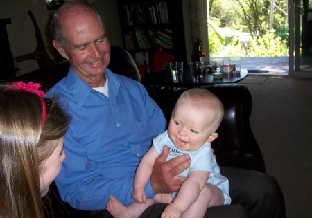 Jack 7 mo, on Papa's lap. Smiles all around.