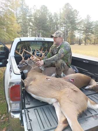 Dennis Burdett holding our deer for photo 