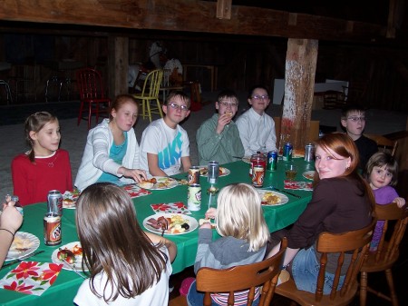 Grandchildren eating in the barn
