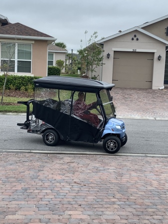 Me driving our golf cart 