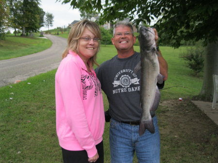 Brother John's girlfreind Joy. this is the first catfish she has caught in her life. Fishing in the pond in our front yard...........I know.... If you have a pond in your front yard,  you just might be a redneck...lol