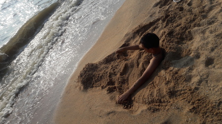 Boy mermaid in the sand?