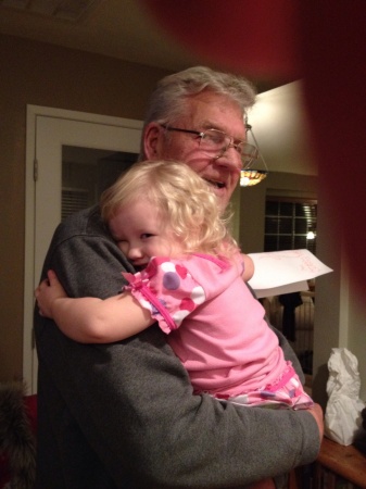 Lottie giving great grandpa Ron a hug.