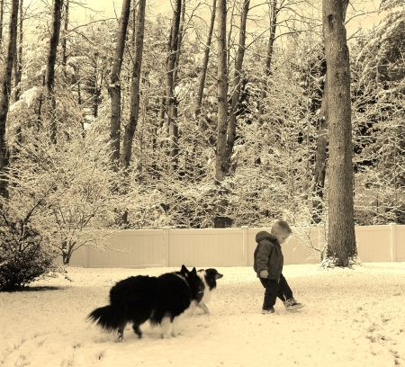 Caden and pets in bck yard.