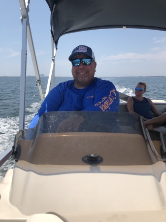 Chris piloting the pontoon boat…