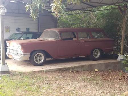 Old 58 Chevy yeoman 2 door wagon rusting away 