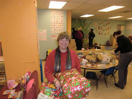 Volunteer wrapping presents