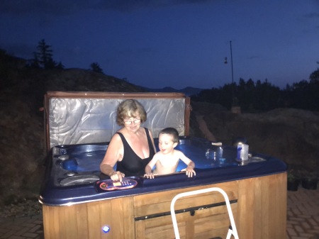 My wife, Mary in hot tub w/Miles 7-23