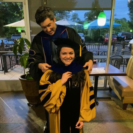 Getting hooded by my PhD advisor