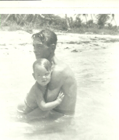 My dad holding for the first trip to the beach in Miami
