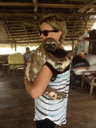 holding sloth in Peru
