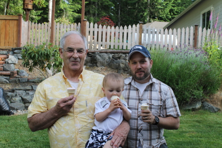 sharing first icecream cone grandpa and daddy