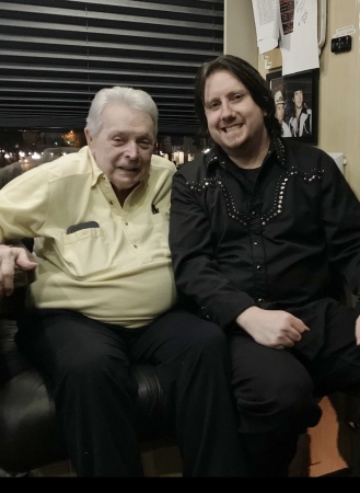 Rusty and Mickey Gilley on the bus