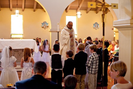 Fr. Leo talking to the First Communicants