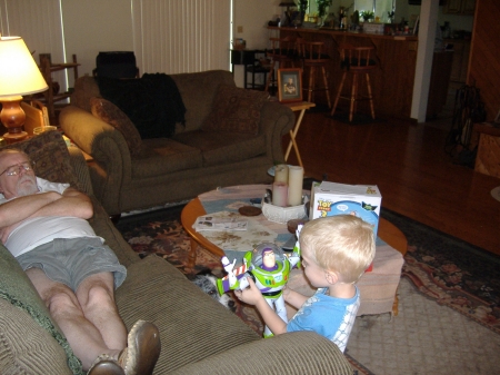 Pop-Pop baby sitting grandson and Buzz Lightyear