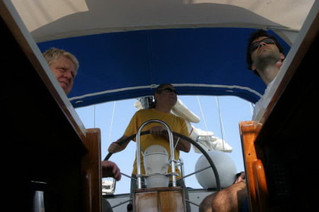 At the helm, sailing from Bermuda.