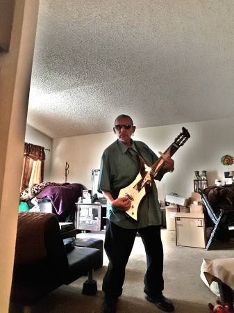 Playing a Powder Slide Guitar with a Bone 