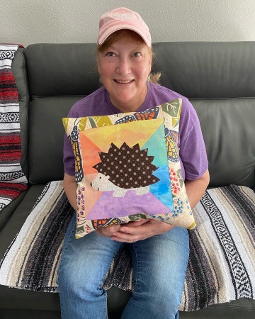 With a pillow I made for my granddaughter 