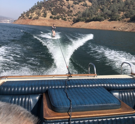 Wife Kristy on wake behind our classic Cobalt