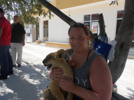 Christine holding lion cub