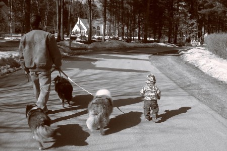 Caden & father walking the dogs.