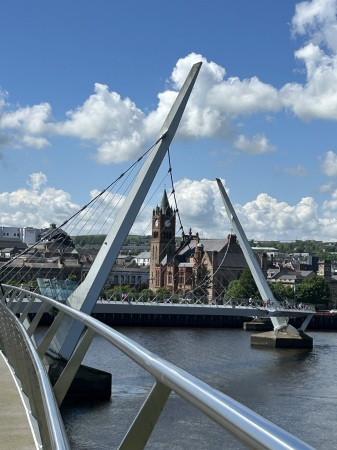 Peace Bridge Derry Ireland with Guildhall 