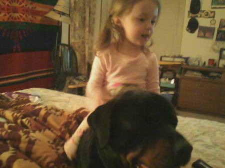 magz kicking it with her big dog on the bed.
