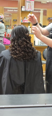 Angel getting her hair done for prom 2022