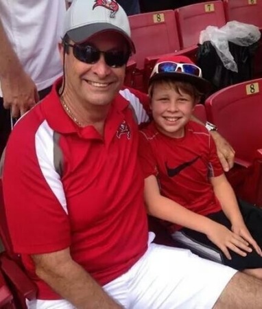 My grandson Tristan and I at a Buccaneers foo