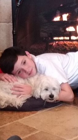 My grandson Colby with my grand dog Roscoe