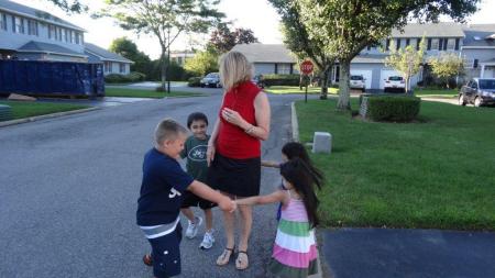 Gloria with grandson and twin grand-daughters.