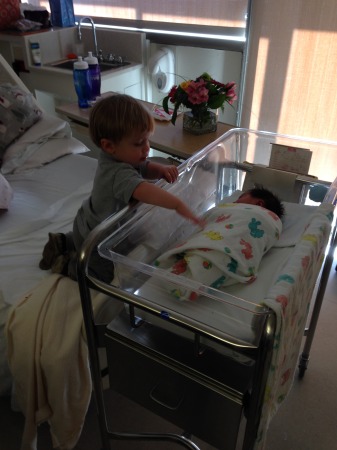 Landon saying hi to his new baby sister, Lily